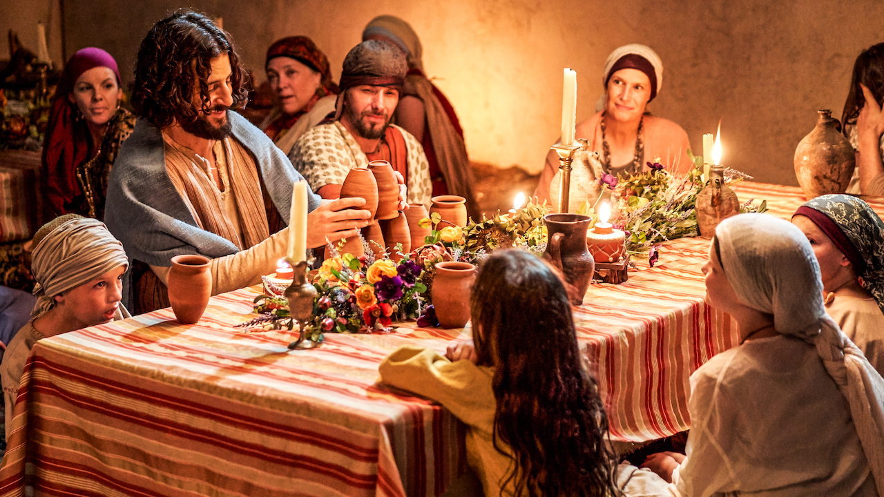 Jonathan Roumie as Jesus with children at a wedding in The Chosen